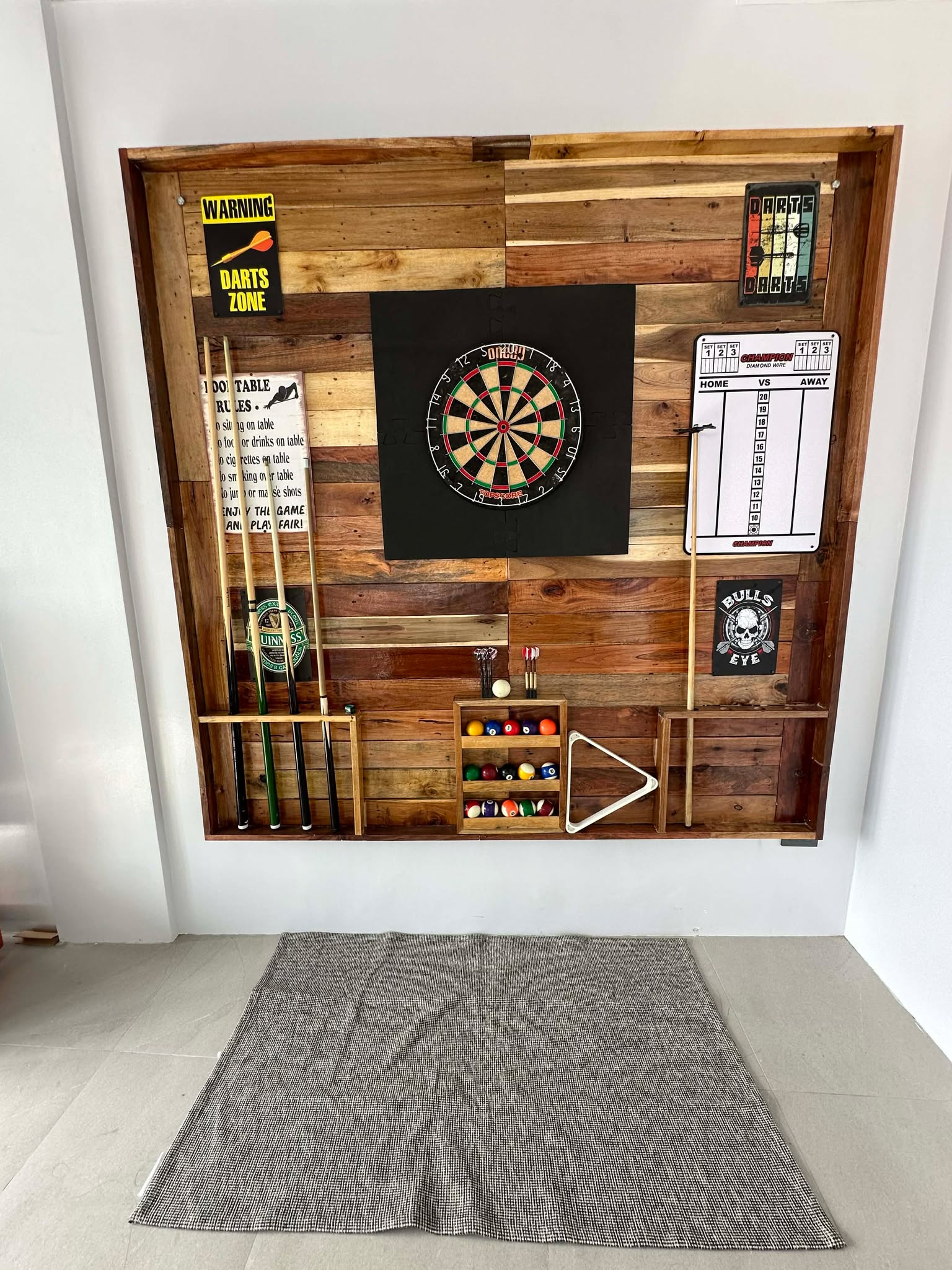 Dart board and game wall at La Casa de Miguel