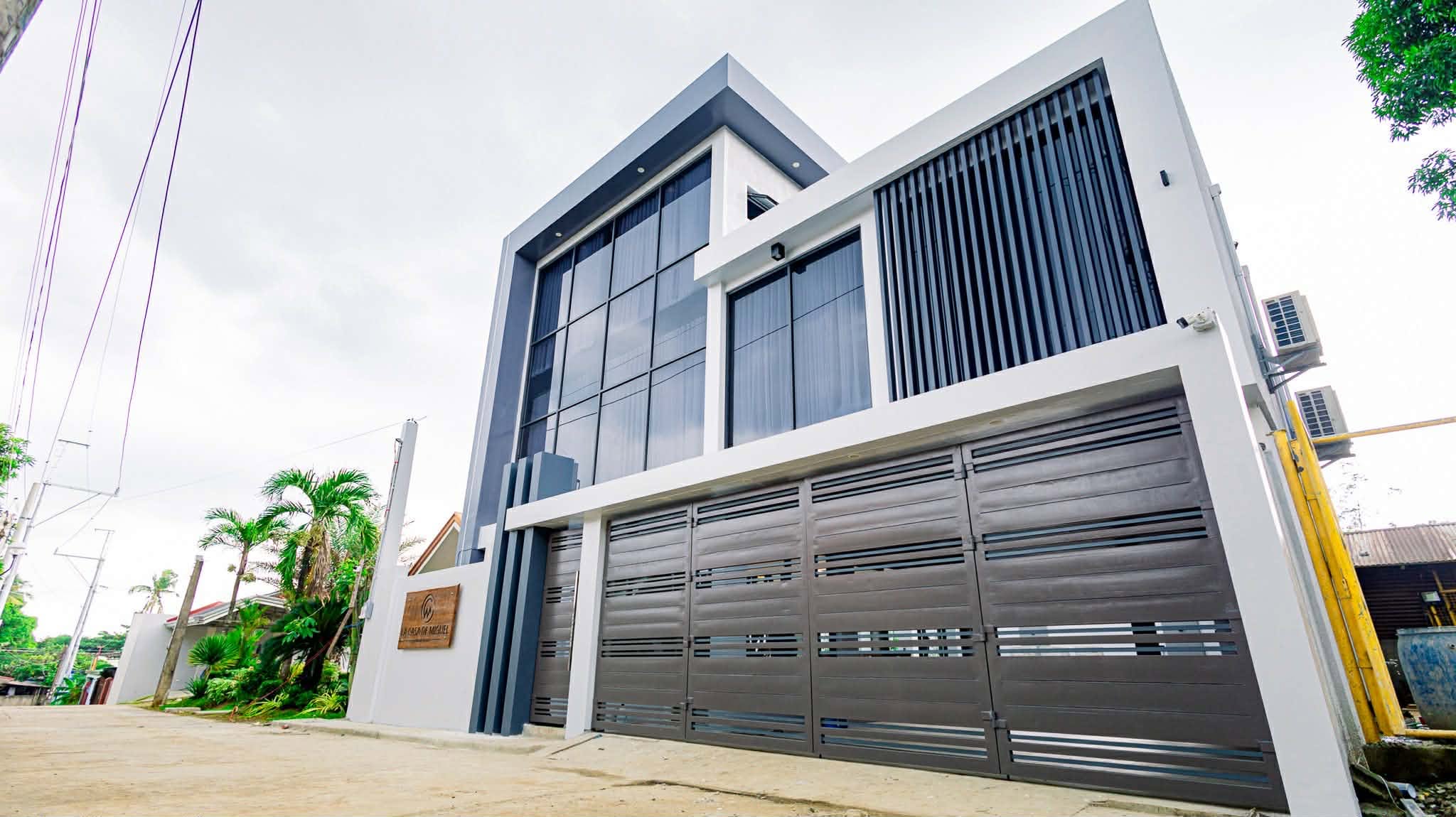Modern exterior facade and gate of La Casa de Miguel